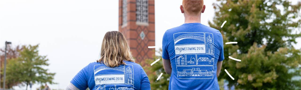 Students wearing Homecoming t-shirts in front of the clock tower